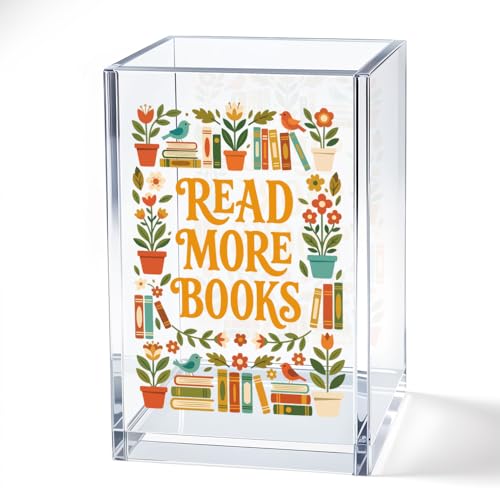 A clear acrylic pen holder printed with read more books and florals
