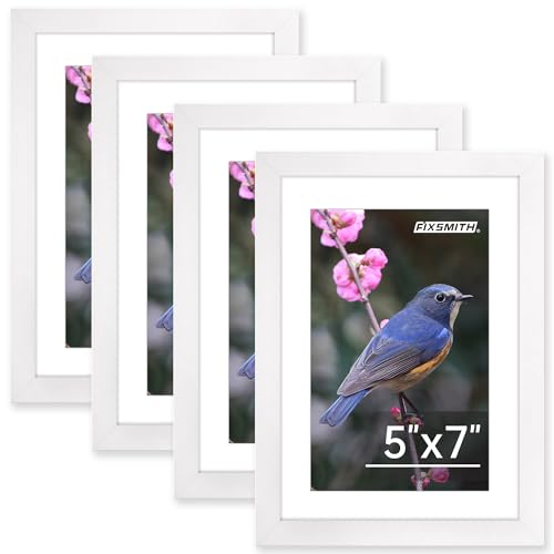 Four white picture frames with white mats