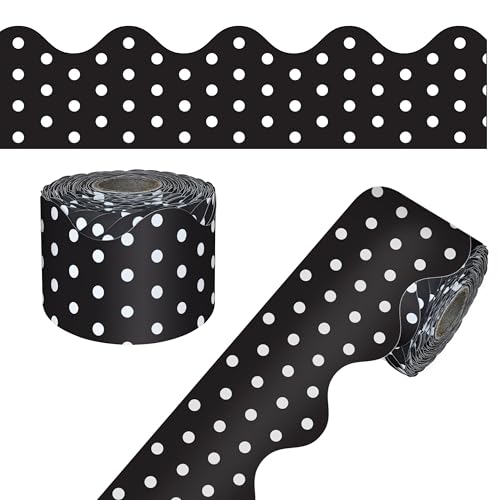 A rolled scalloped bulletin board border in black with white polka dots.
