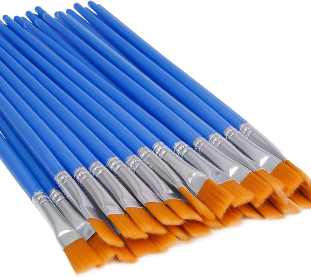 Set of small flat paint brushes with blue handles