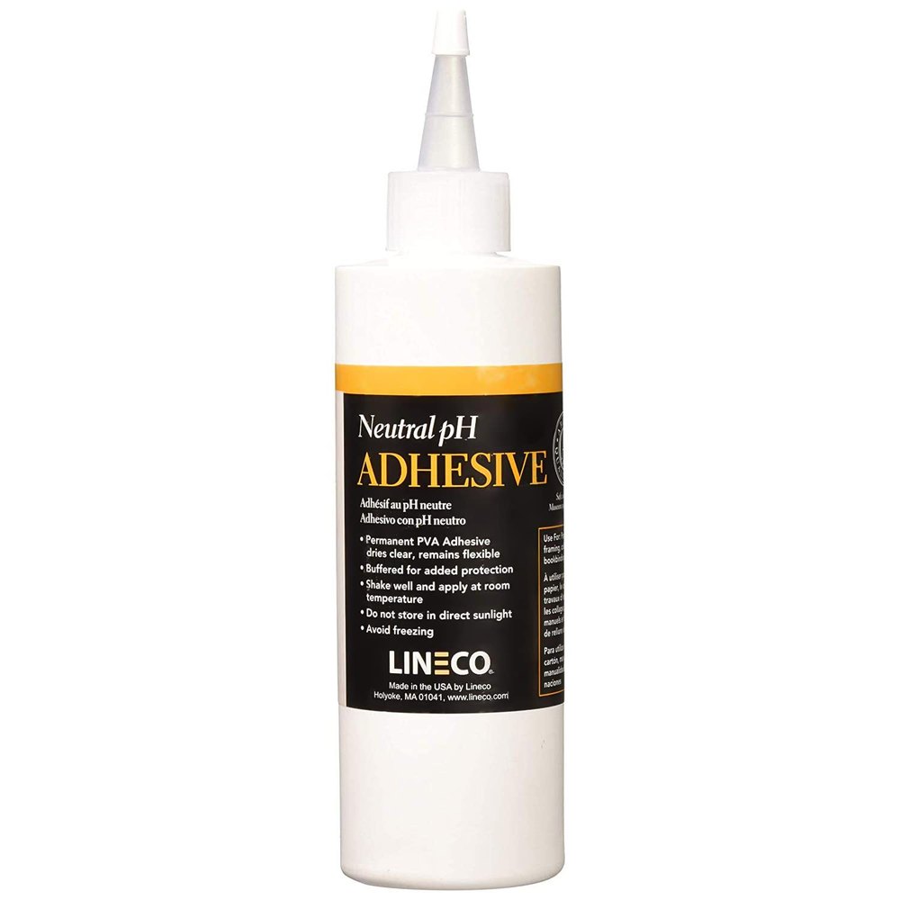 White eight-ounce bottle of neutral pH acid-free PVA adhesive