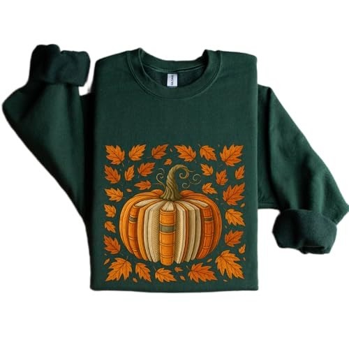 Forest green sweatshirt with a large pumpkin made from book spines surrounded by fall leaves