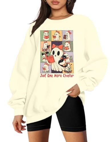 Cream sweatshirt with a comic-panel grid of reading ghosts and a ghost cat holding a red book