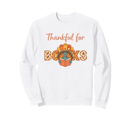 White sweatshirt with a turkey standing on a stack of books beneath the words Thankful for Books