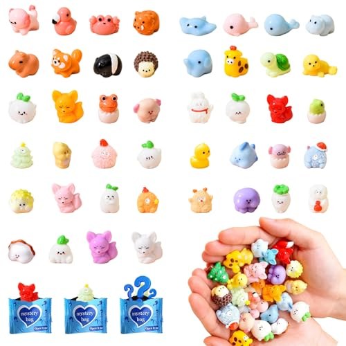 Assorted tiny glow-in-the-dark resin animal figurines and a handful of individually wrapped blind bags