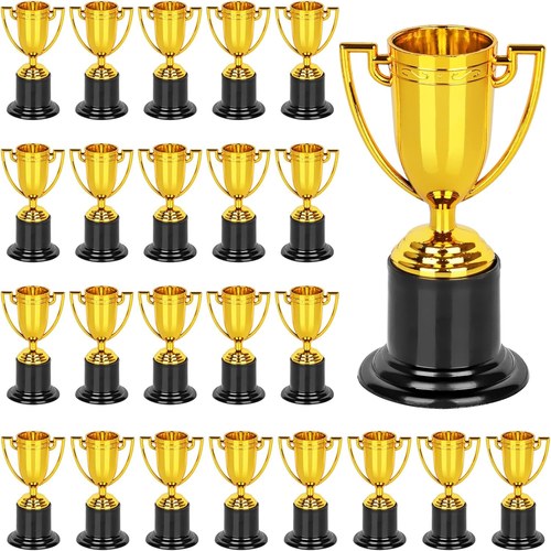 Rows of small gold plastic trophy cups on black bases
