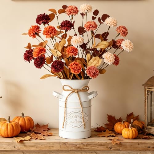 Dried-look chrysanthemums in rust, blush and burgundy arranged in a white metal milk can
