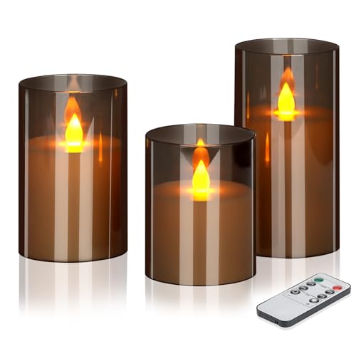 Three smoked glass pillar candles with moving LED flames beside a handheld remote