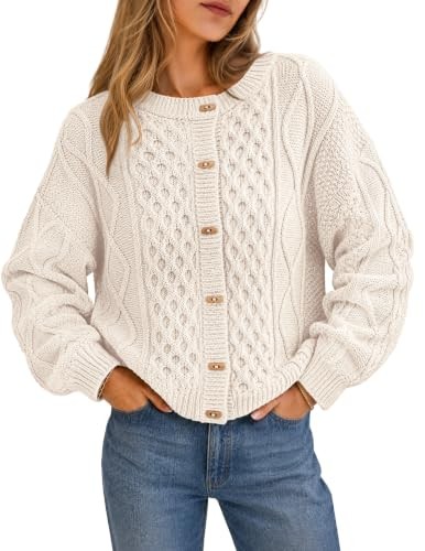 Ivory cable knit cardigan with horn buttons and a scalloped edge, worn open over jeans