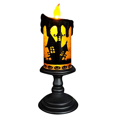 Tall glass snow globe candle with swirling glitter and black bats inside