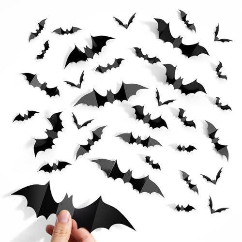 Sheets of black paper bats in three sizes with a wall arrangement climbing upward