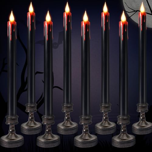 Black taper candles with red wax drips and flickering LED flames on small bases