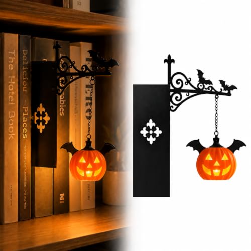 Tiny pumpkin lantern tucked on a bookshelf casting a warm amber glow