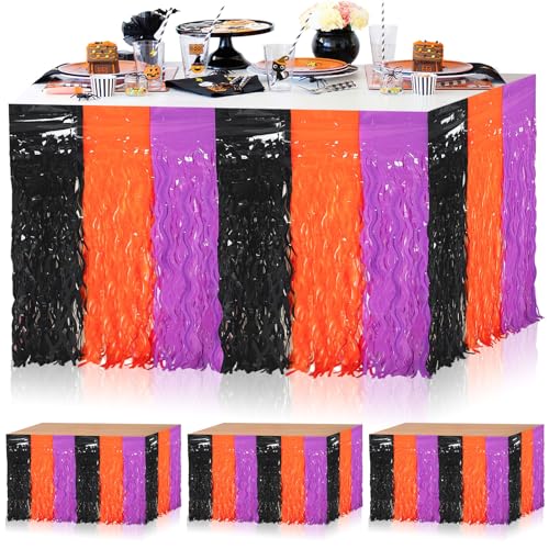 Metallic fringe table skirting in orange, purple and black panels