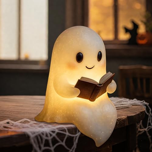 White ghost figurine holding a book that lights up warmly
