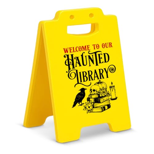 Small black standing sign with gothic lettering reading haunted library