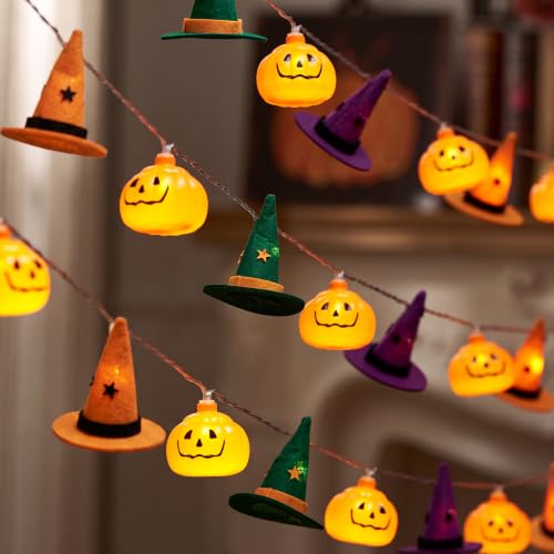 String lights with orange, purple and green pumpkin and witch hat covers