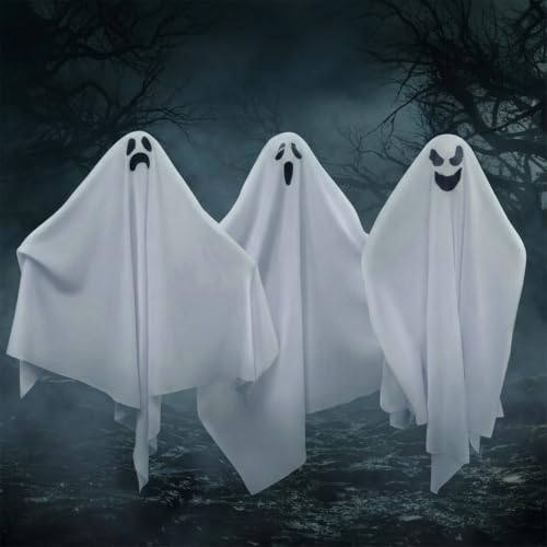 Three white hanging ghosts with trailing fabric and printed faces