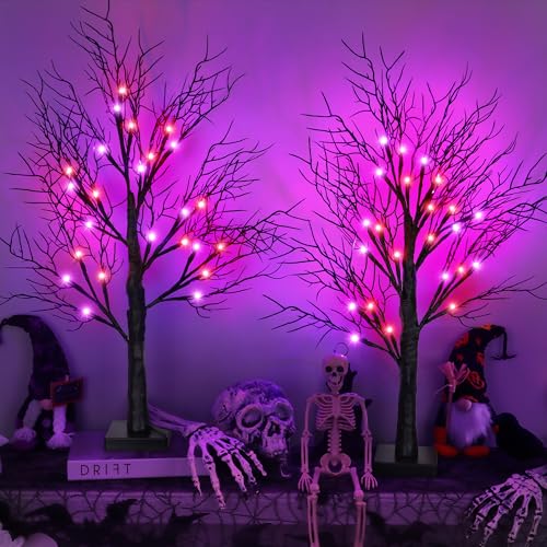 Two bare black branch trees lit with small orange and purple LED lights