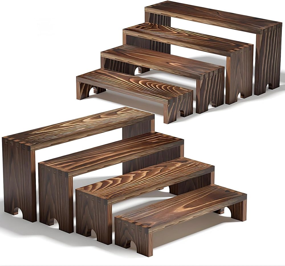 Two stackable wooden tiered display risers in a light finish