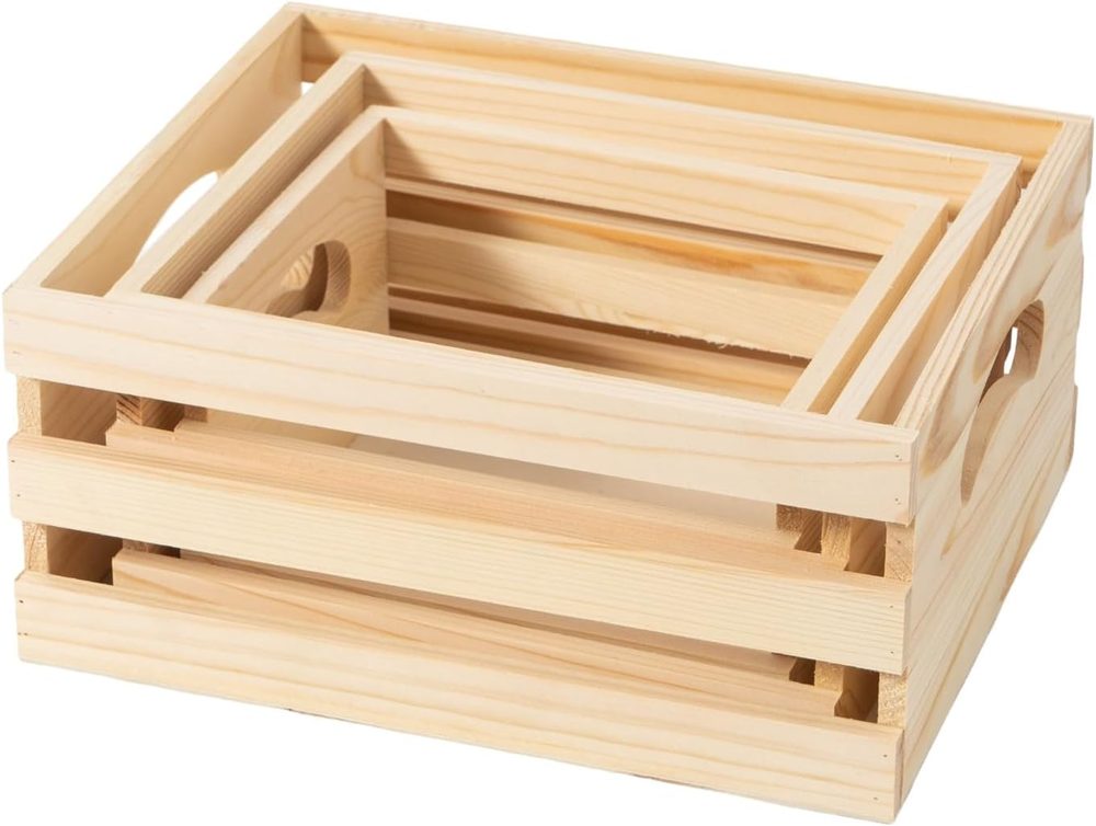 Set of three rustic wooden nesting crates with cutout handles