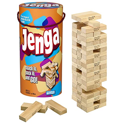 Jenga wooden block tower standing beside its box