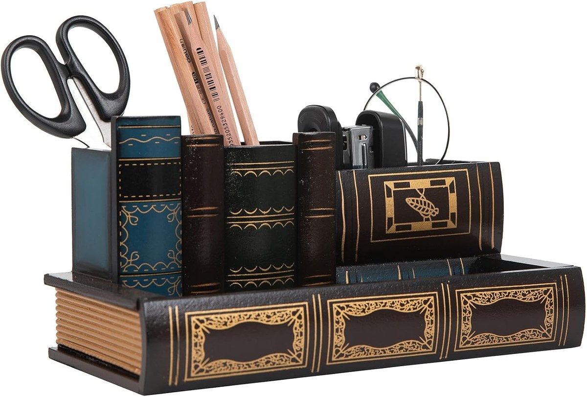 Wooden desk caddy shaped like a row of antique book spines holding pens scissors and a stapler
