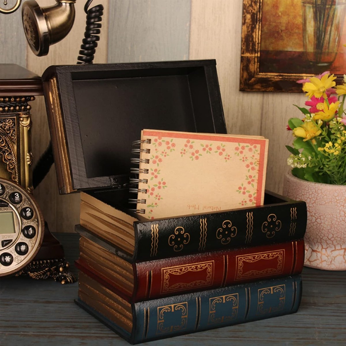 Two lidded wooden boxes made to look like stacked antique books with gilt spines